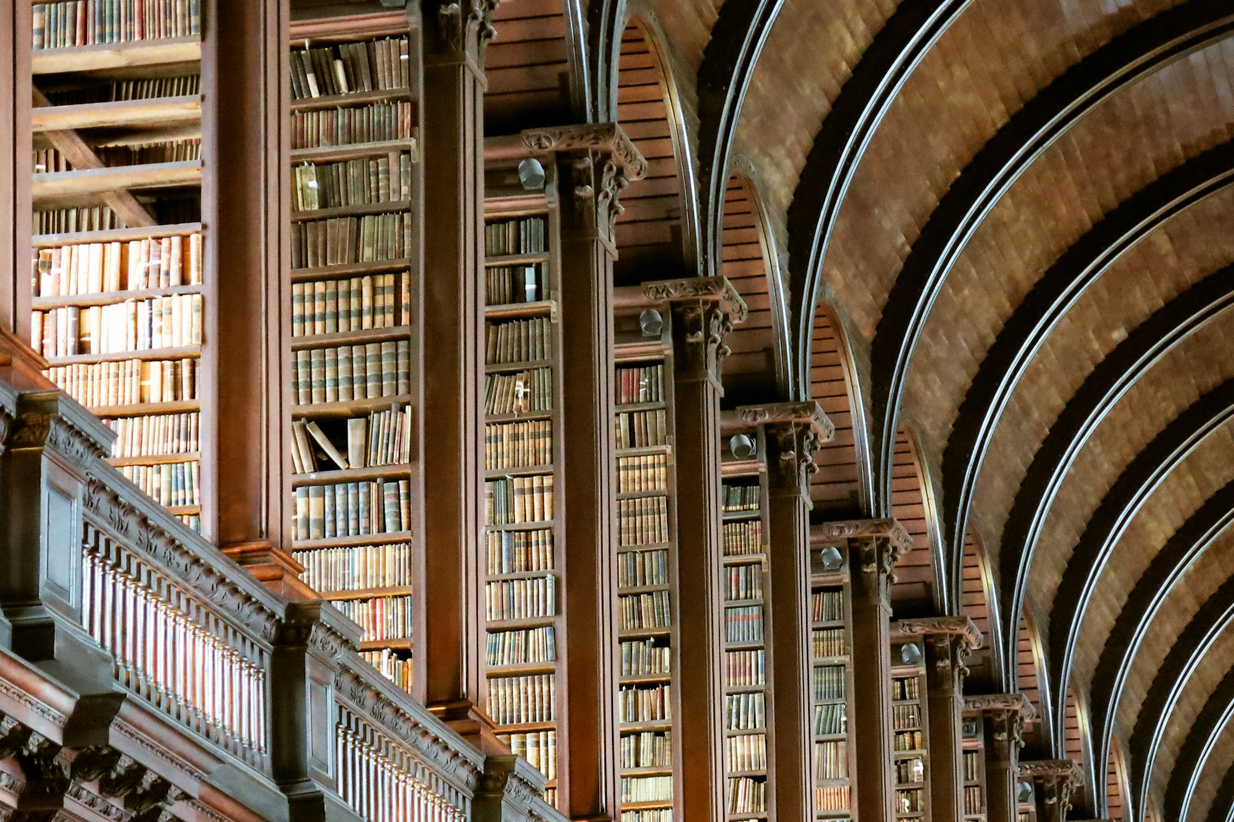 Arched library shelves filled with legal reference books